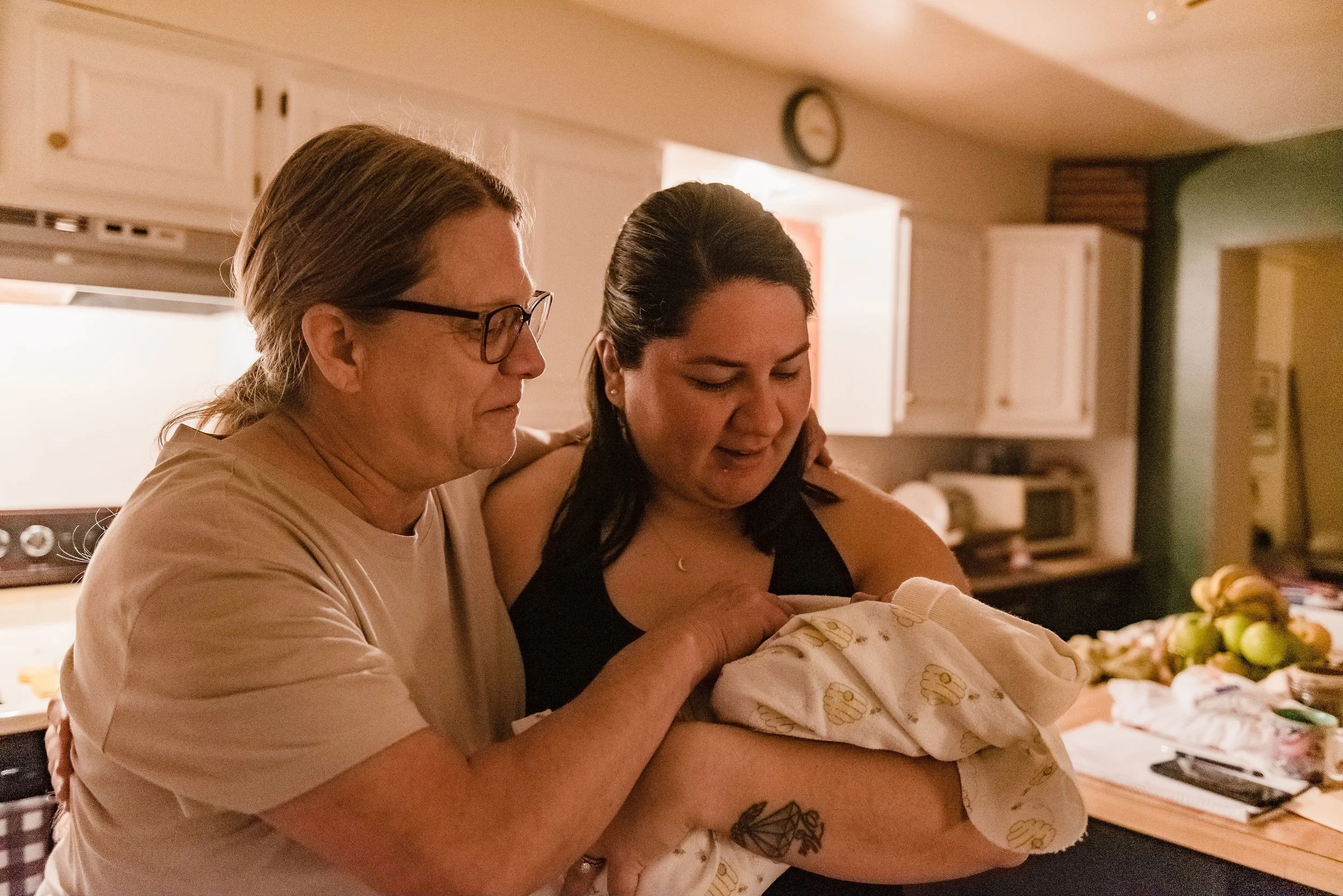 Baby held after a home water birth