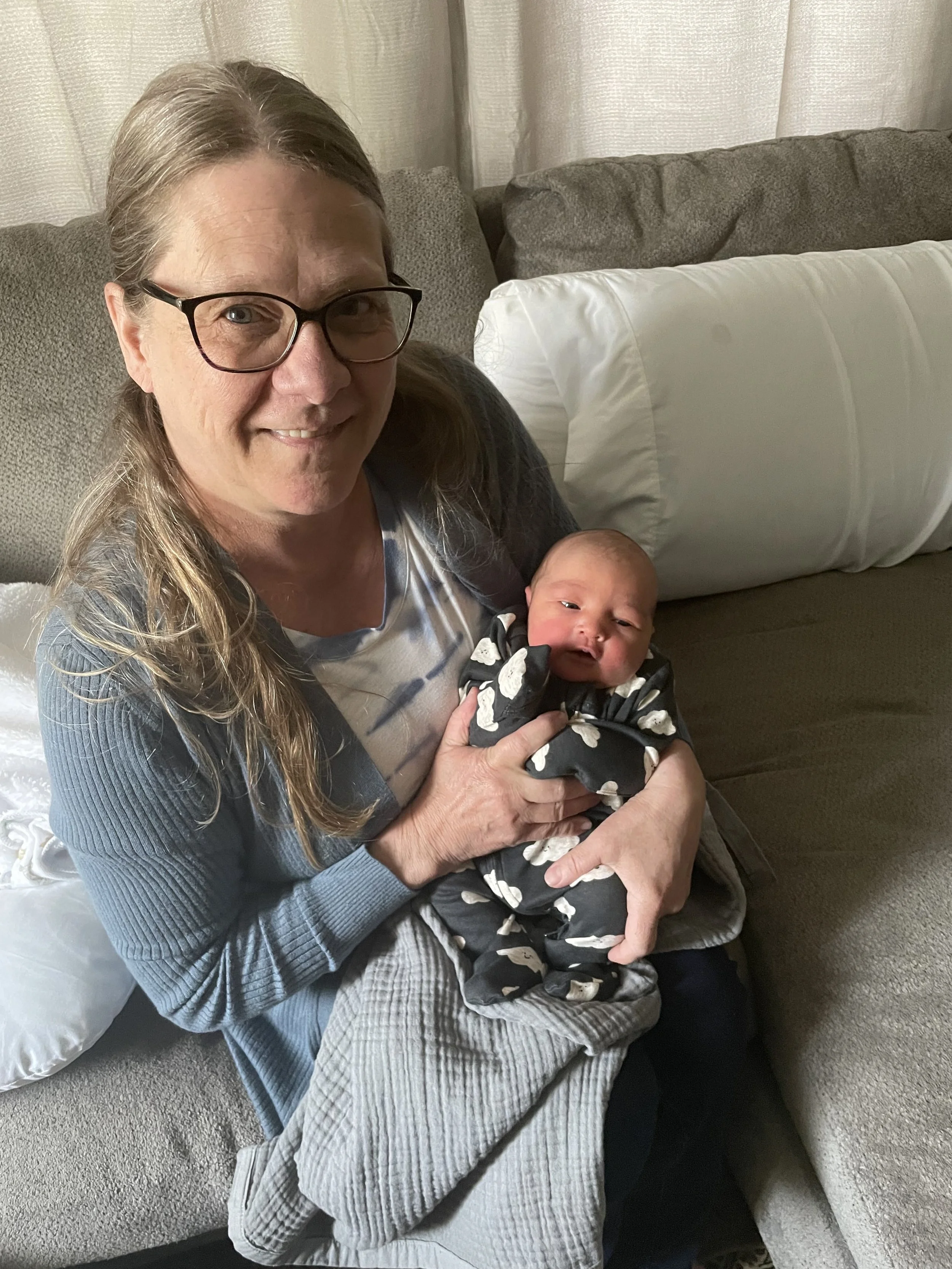 A newborn swaddled at home