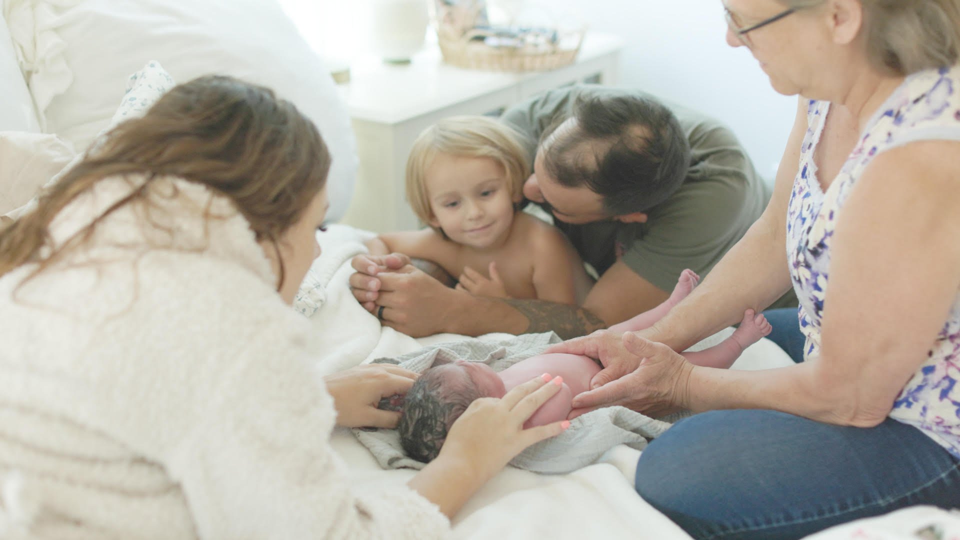 Parents with their new baby at home